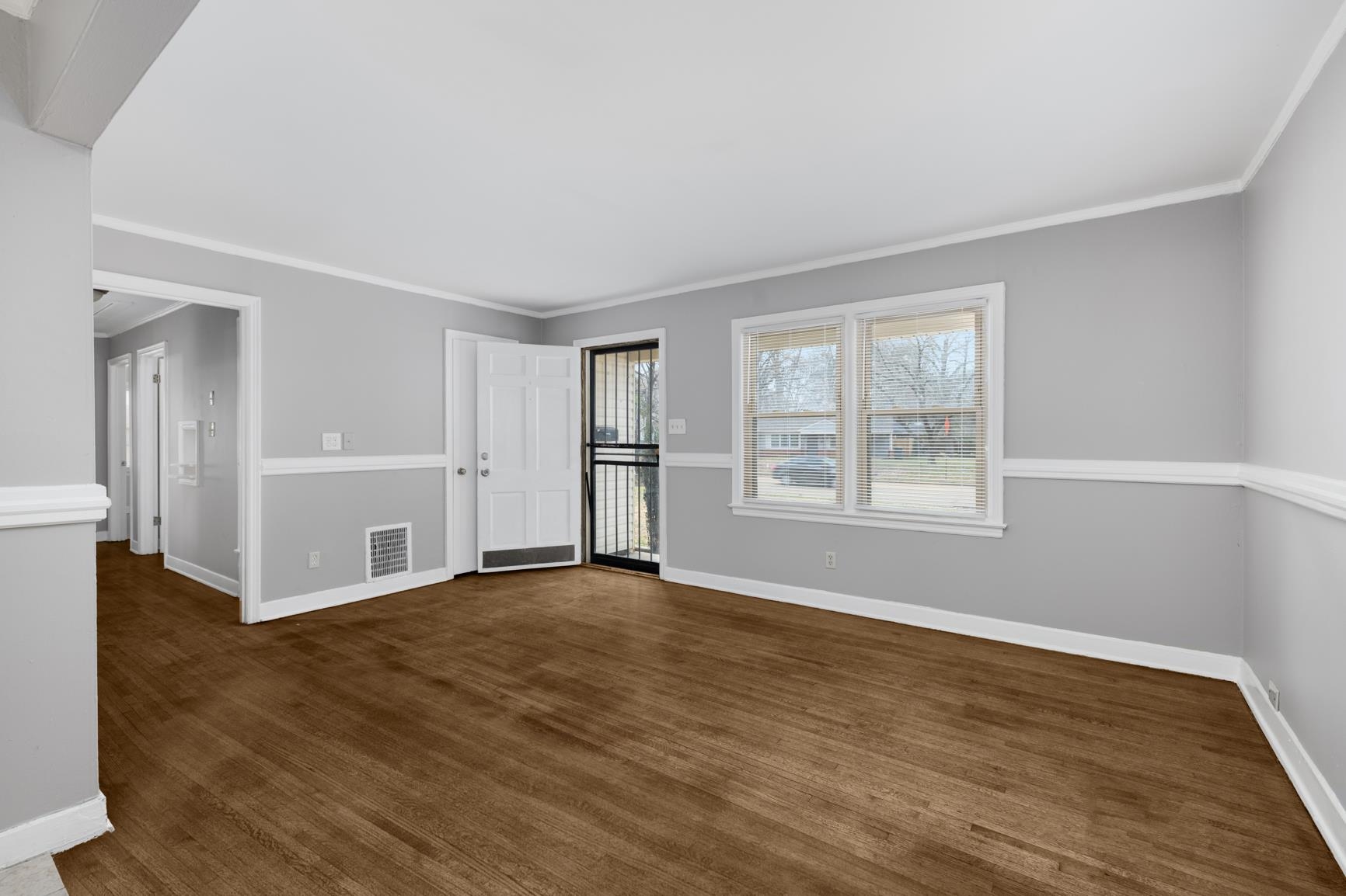 1584 South Perkins Road Memphis, TN 38117 - Photo 4 of 21 Spare room with visible vents, baseboards, and crown molding
