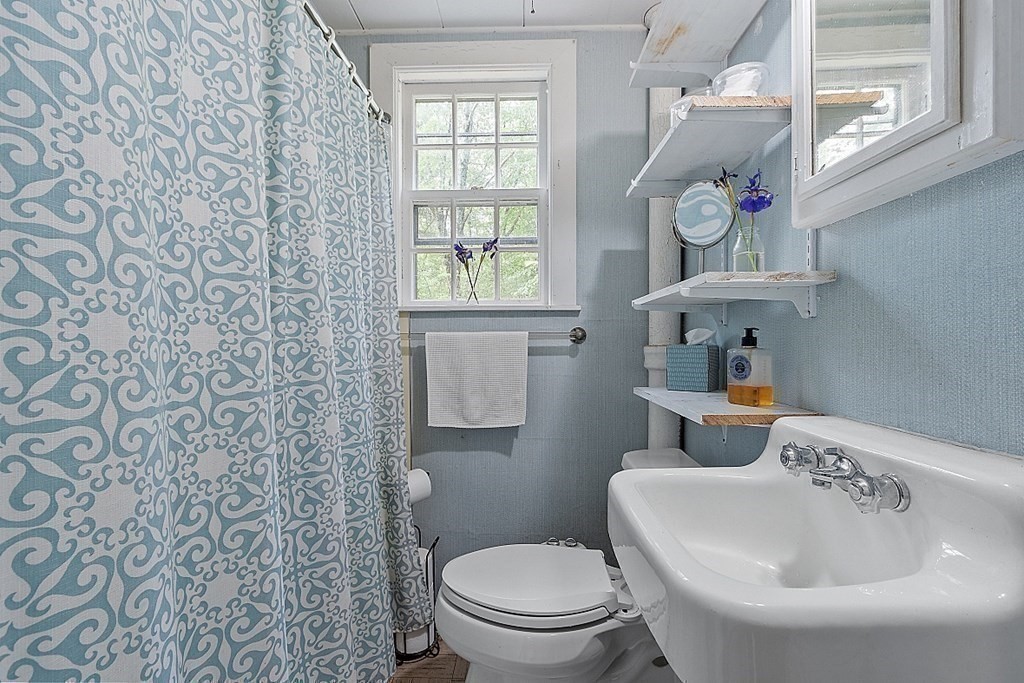 50 Sauna Row Road Townsend, MA 01474 - Photo 15 of 41 a bathroom with a toilet a sink and a window