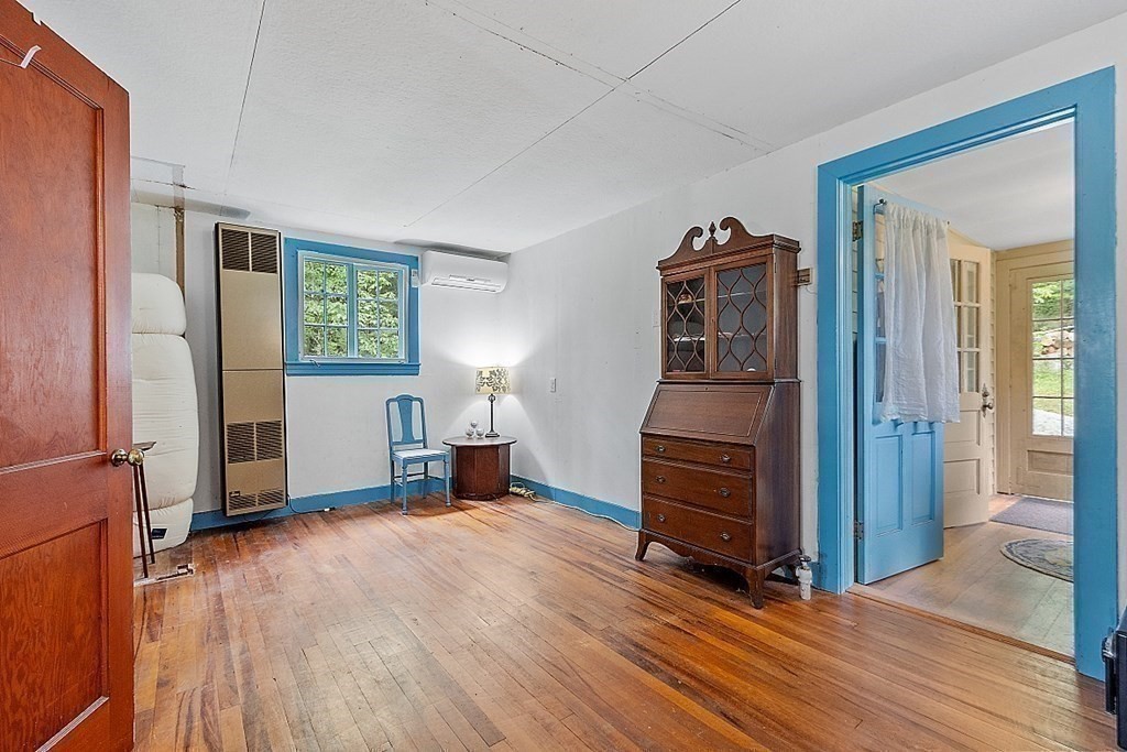 50 Sauna Row Road Townsend, MA 01474 - Photo 17 of 41 a view of a livingroom with furniture wooden floor and windows
