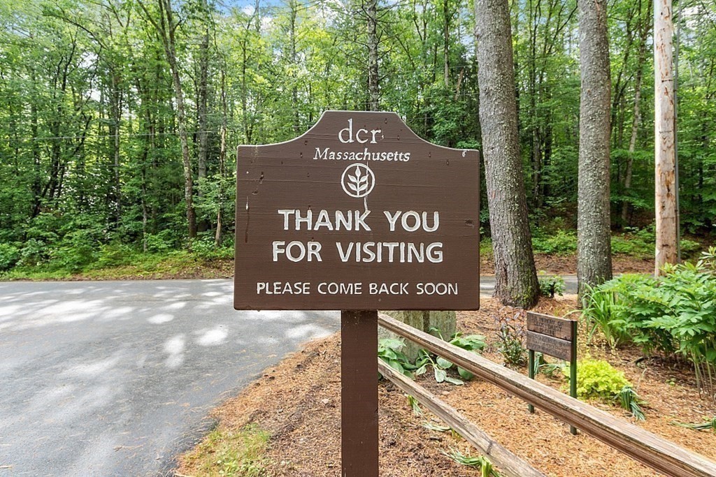 50 Sauna Row Road Townsend, MA 01474 - Photo 27 of 41 a view of outdoor space with signage and flags