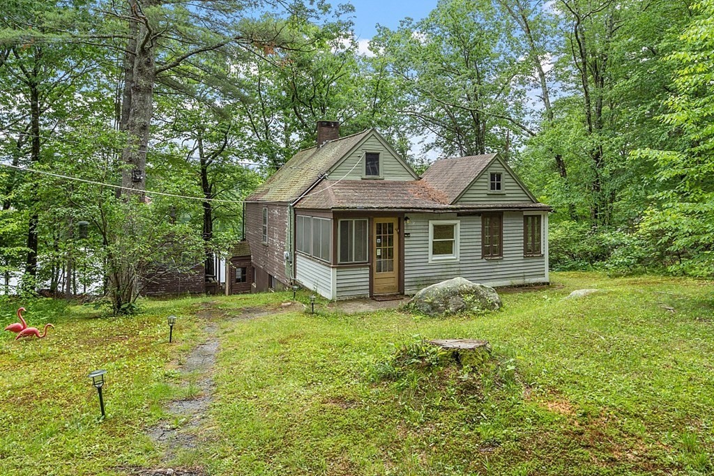 50 Sauna Row Road Townsend, MA 01474 - Photo 3 of 41 a front view of a house with a garden and trees