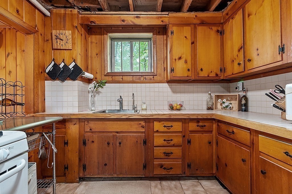 50 Sauna Row Road Townsend, MA 01474 - Photo 7 of 41 a kitchen with a sink and cabinets