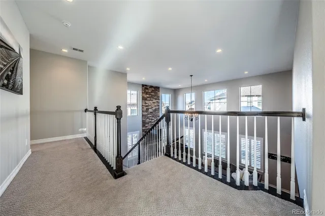 a view of a hallway with windows