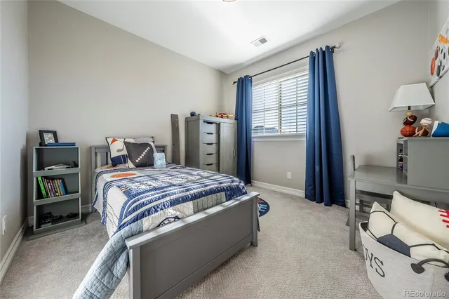 a bedroom with a bed and furniture