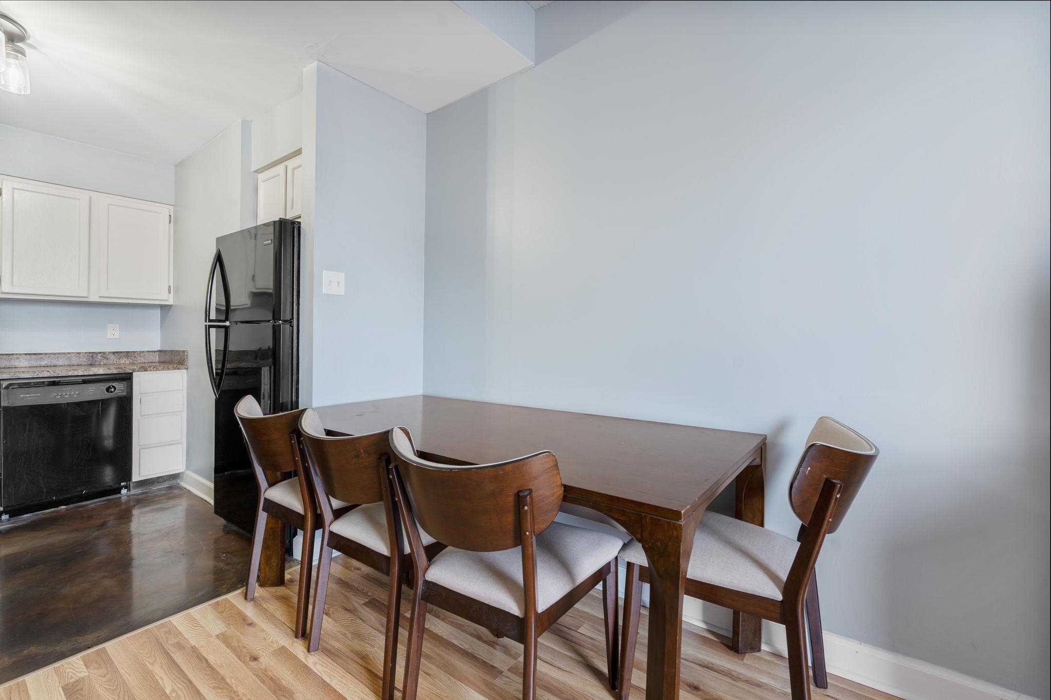 109 North Main Street, Unit 710 Memphis, TN 38103 - Photo 12 of 37 Dining area with light wood-type flooring and baseboards