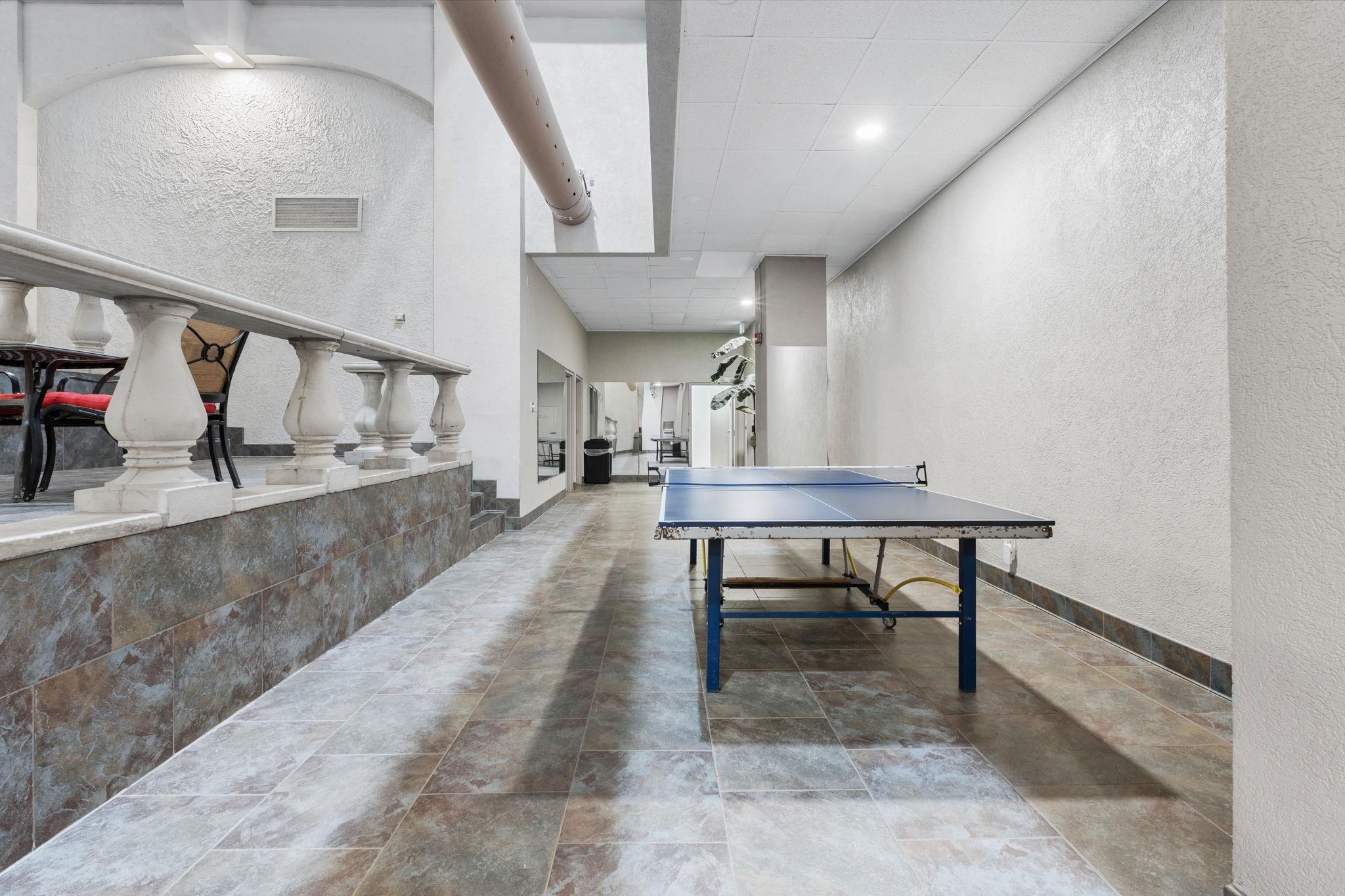 109 North Main Street, Unit 710 Memphis, TN 38103 - Photo 34 of 37 Game room featuring a textured wall, recessed lighting, and a high drop ceiling