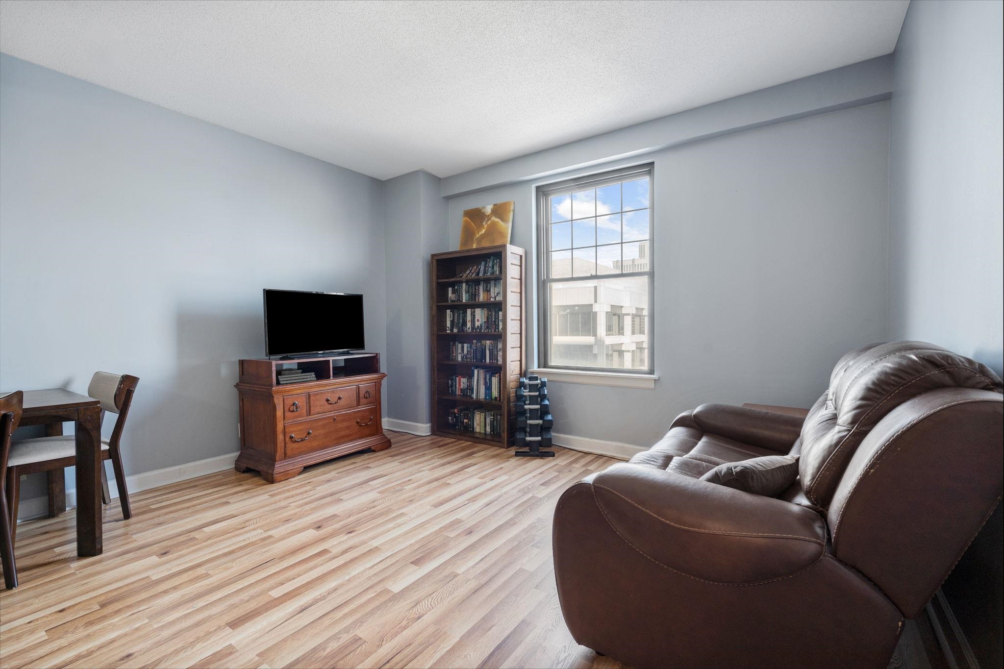 109 North Main Street, Unit 710 Memphis, TN 38103 - Photo 10 of 37 Living area featuring light wood finished floors and baseboards