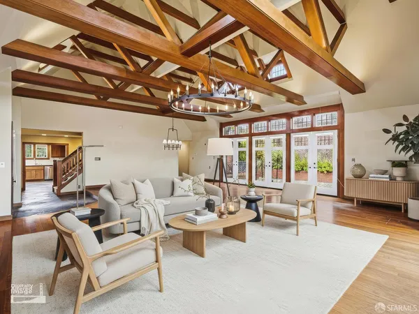 a large kitchen with granite countertop a stove a sink and dishwasher a refrigerator with wooden cabinets