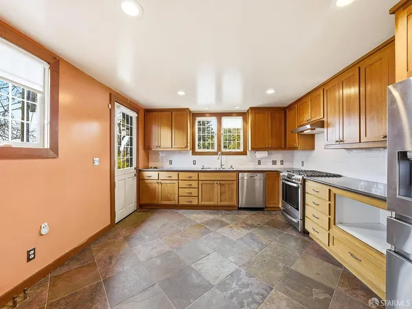 a spacious bathroom with a double vanity sink and a mirror