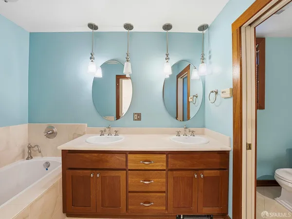 a bathroom with a shower and a bathtub