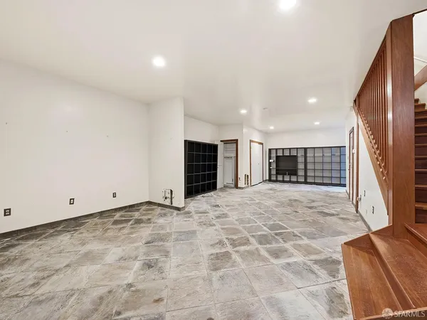 a view of a bathroom with a sink and a mirror