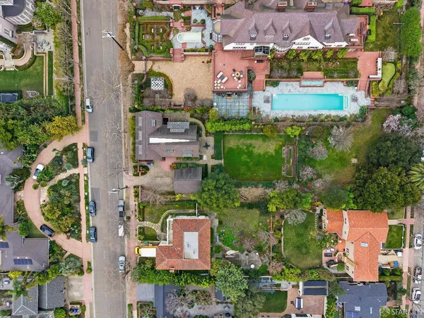 an aerial view of a house with outdoor space