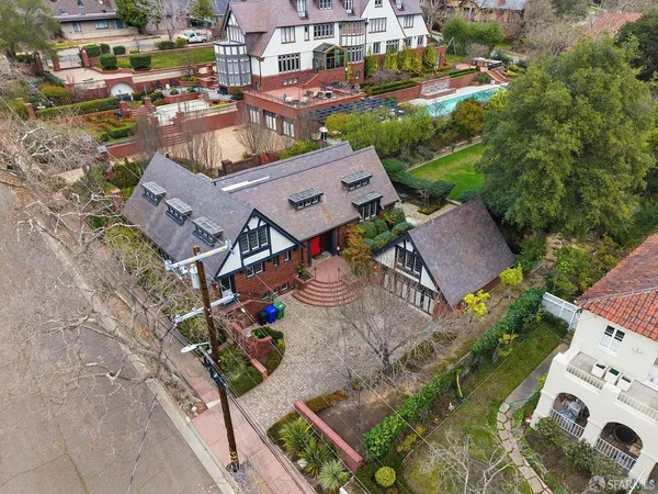 an aerial view of a house with a yard