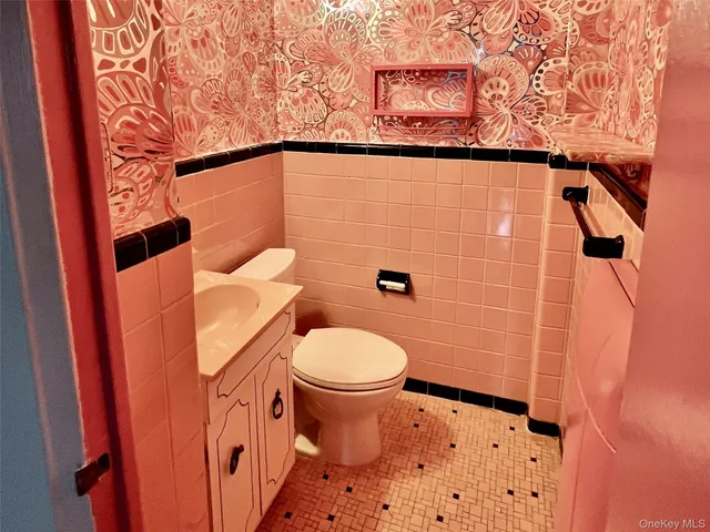 a view of a room with wooden floor and ceiling fan