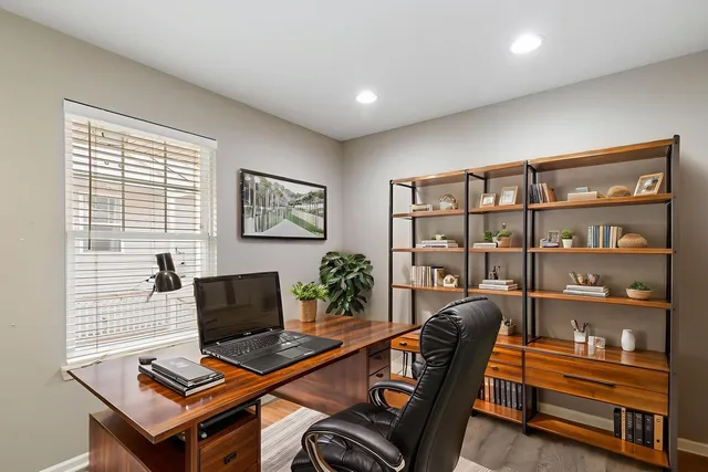 a workspace with furniture and a window