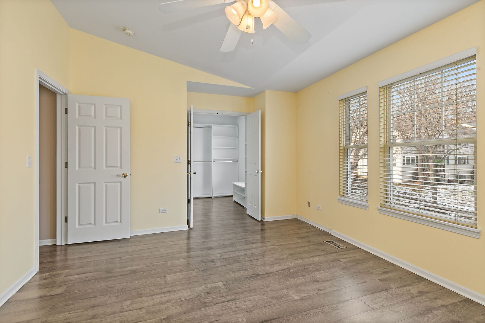 61 Samuel Drive Streamwood, IL 60107 - Photo 15 of 27 a view of an empty room with wooden floor and a window