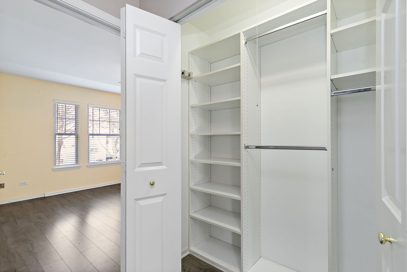 61 Samuel Drive Streamwood, IL 60107 - Photo 17 of 27 a view of walk in closet with empty racks
