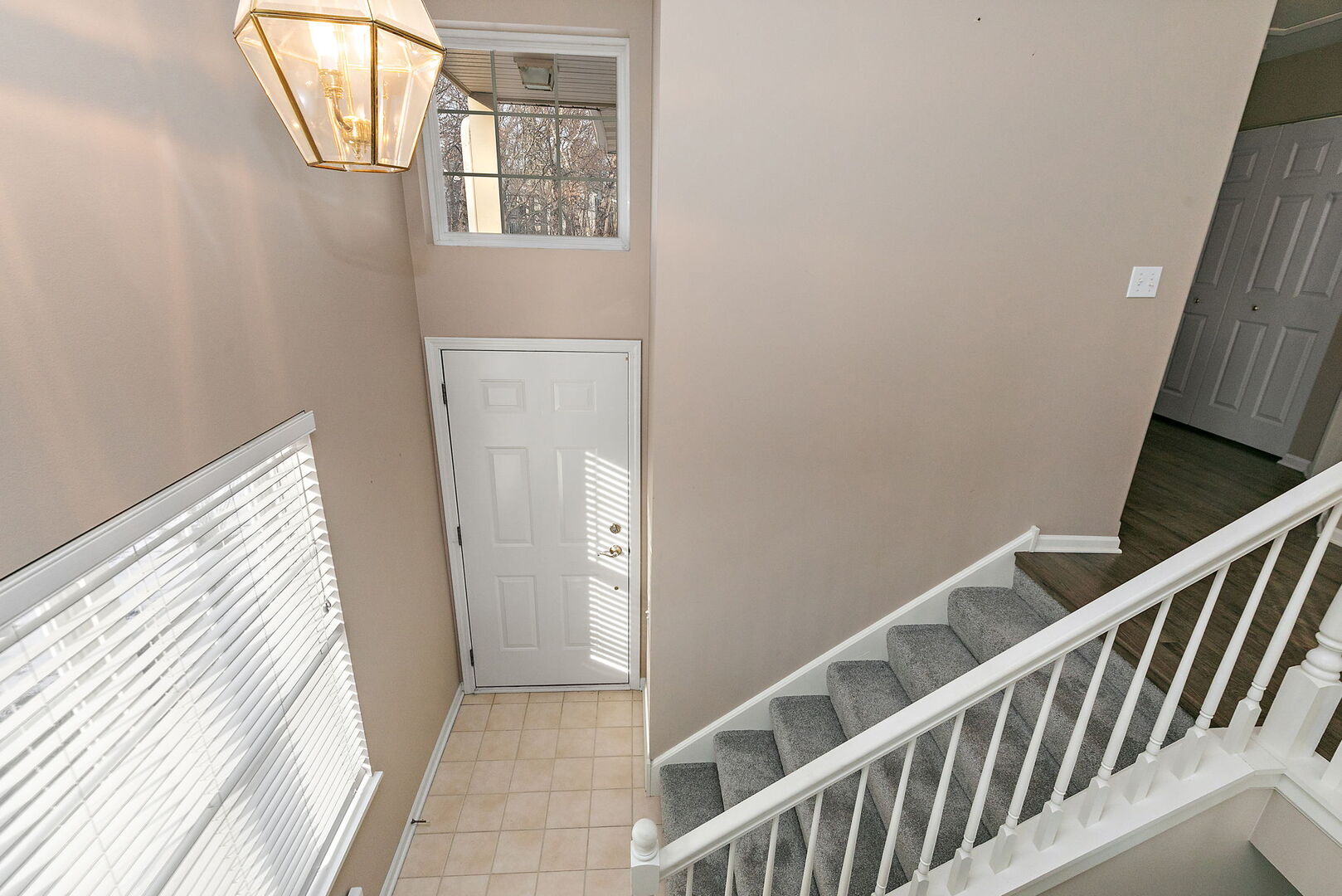 61 Samuel Drive Streamwood, IL 60107 - Photo 2 of 27 a view of a hallway with wooden floor and entryway