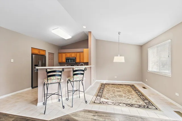 a view of kitchen with furniture and window