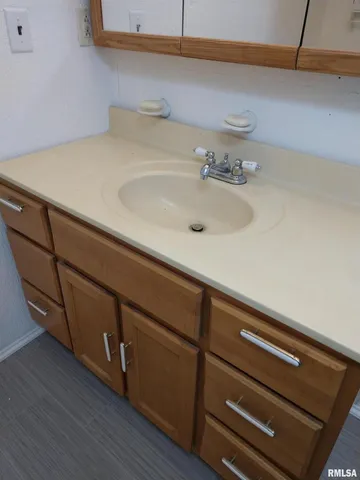 a stove top oven sitting inside of a kitchen
