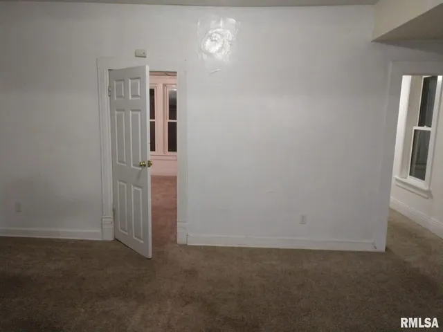 a kitchen with a stove and a window