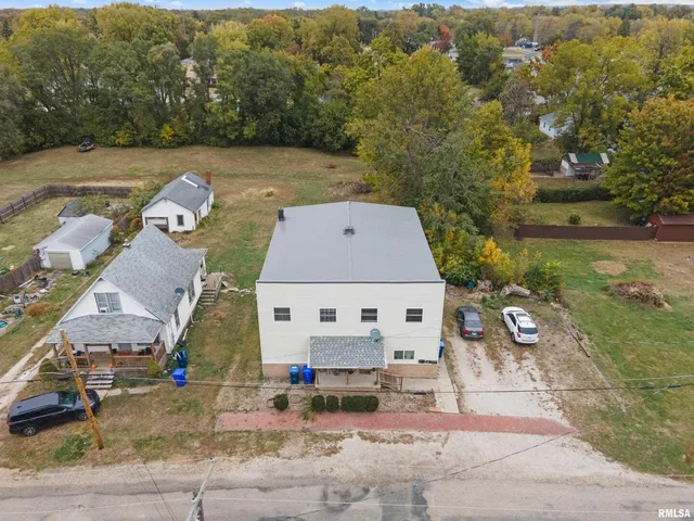 an aerial view of a house with swimming pool