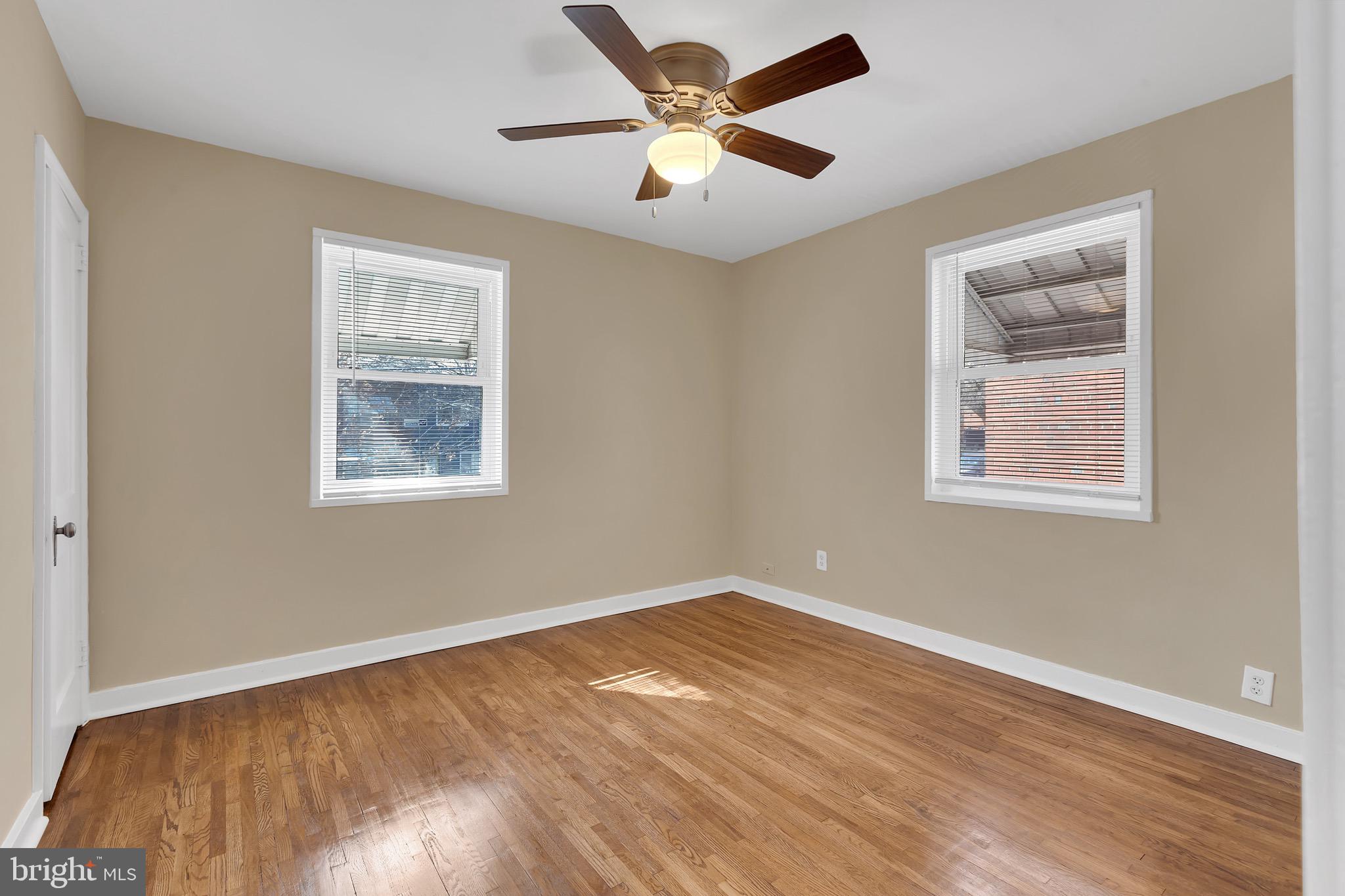 151 Darrington Street Southwest Washington, DC 20032 - Photo 2 of 22 a view of an empty room with window and wooden floor