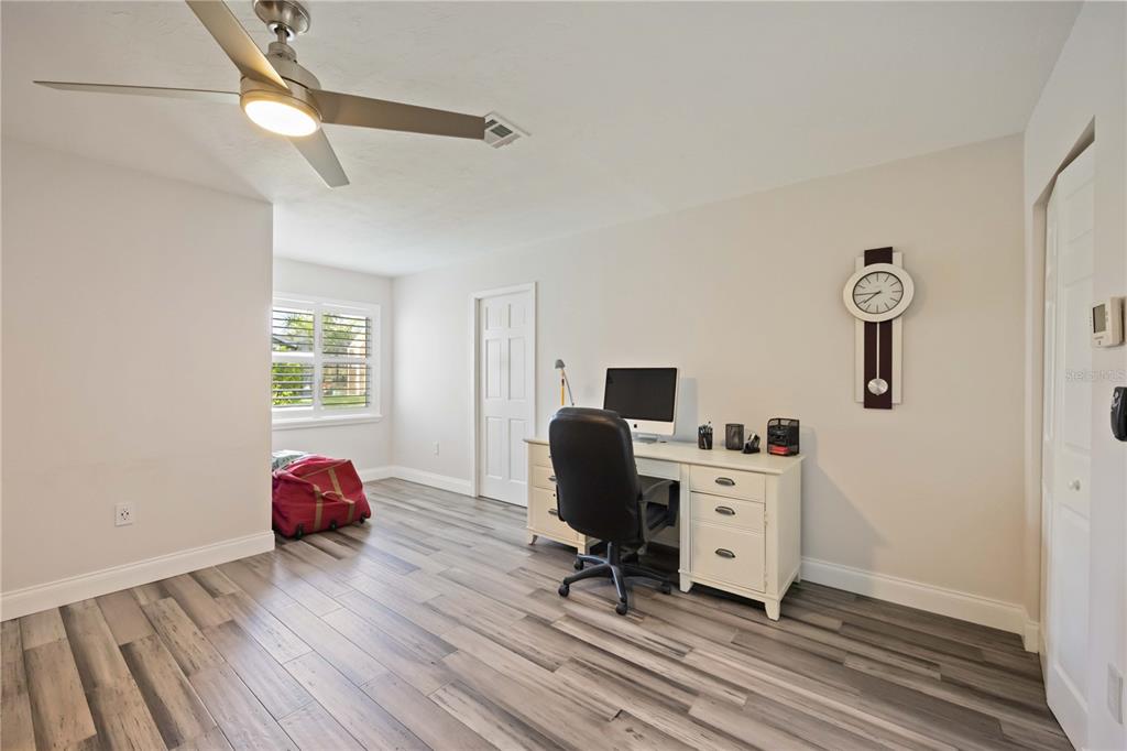 5025 Marsh Field Road Sarasota, FL 34235 - Photo 19 of 69 a view of a workspace with furniture and a window