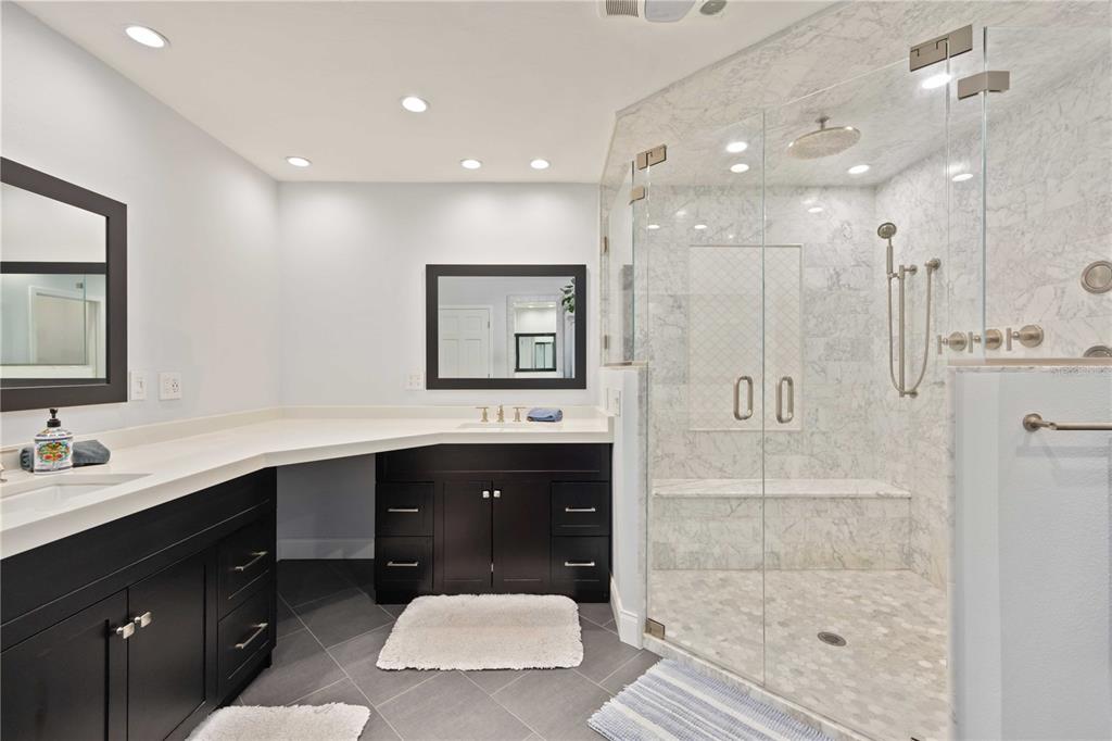 5025 Marsh Field Road Sarasota, FL 34235 - Photo 25 of 69 a spacious bathroom with a shower sink mirror and