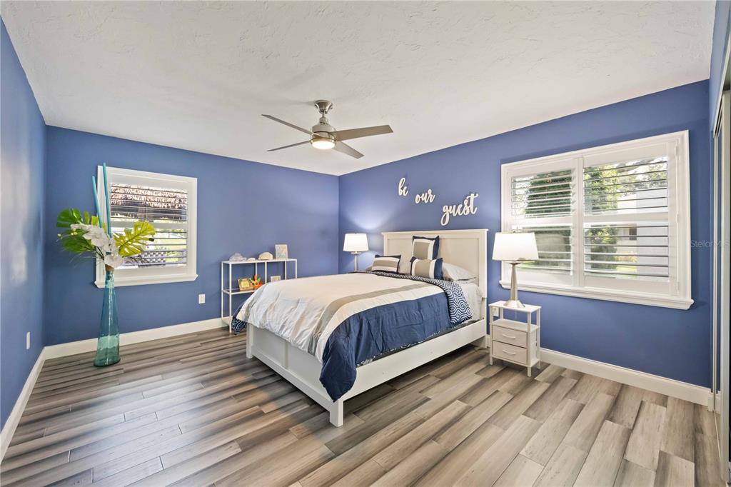 5025 Marsh Field Road Sarasota, FL 34235 - Photo 29 of 69 a bedroom with a bed dresser and a window