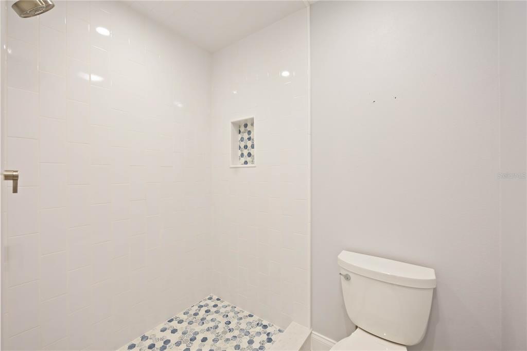5025 Marsh Field Road Sarasota, FL 34235 - Photo 39 of 69 a bathroom with a toilet and a shower