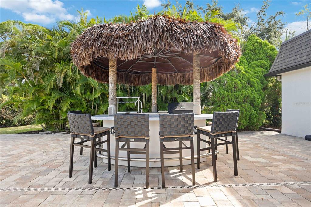 5025 Marsh Field Road Sarasota, FL 34235 - Photo 44 of 69 a view of a chairs and table in the patio