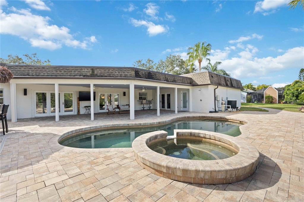 5025 Marsh Field Road Sarasota, FL 34235 - Photo 47 of 69 a view of a house with swimming pool and sitting area