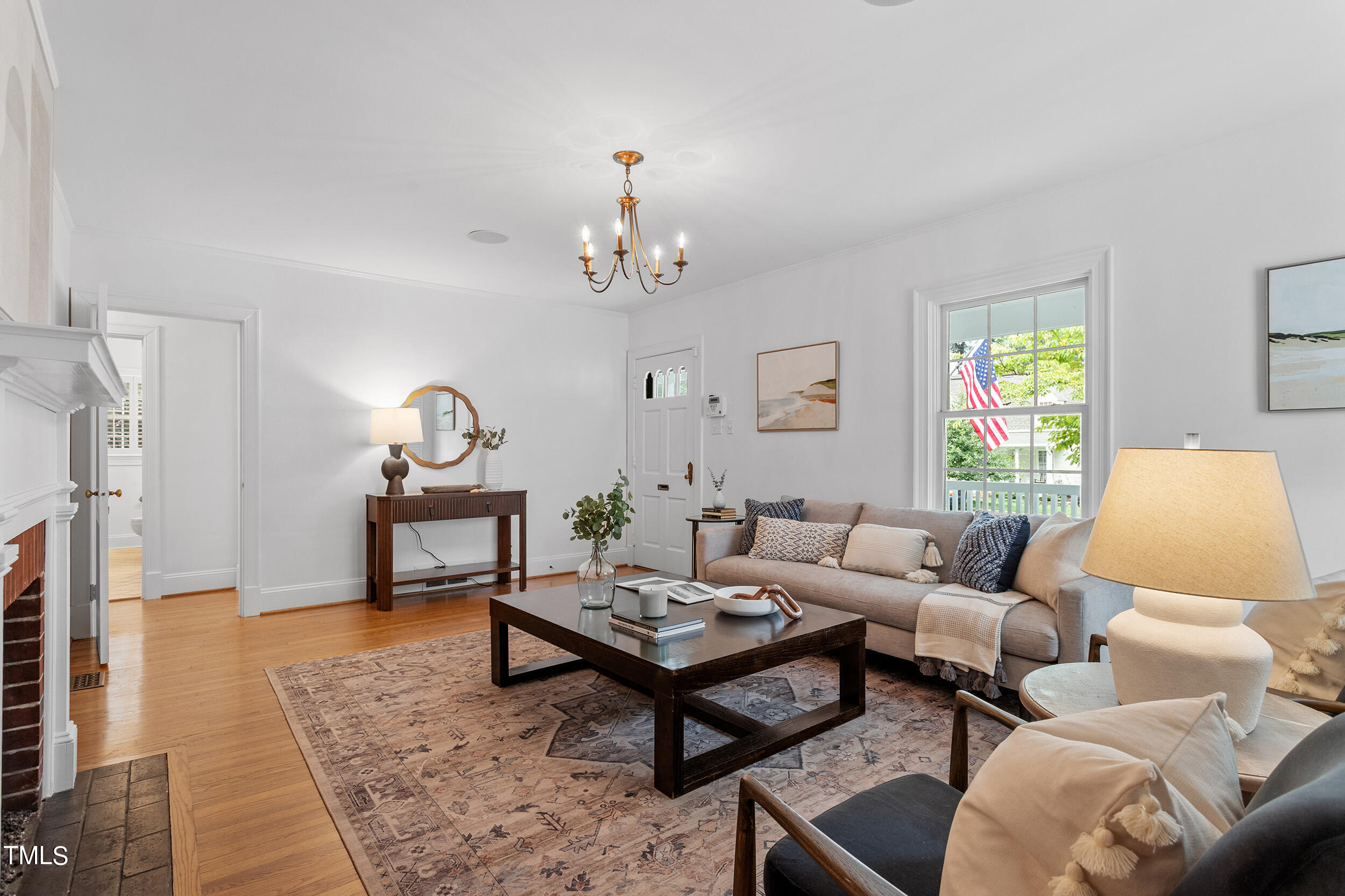 2715 Van Dyke Avenue Raleigh, NC 27607 - Photo 8 of 40 a living room with furniture and a chandelier