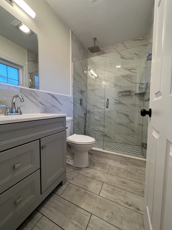 69 Appleton Street, Unit 22 Quincy, MA 02171 - Photo 3 of 8 a bathroom with a sink a toilet and shower