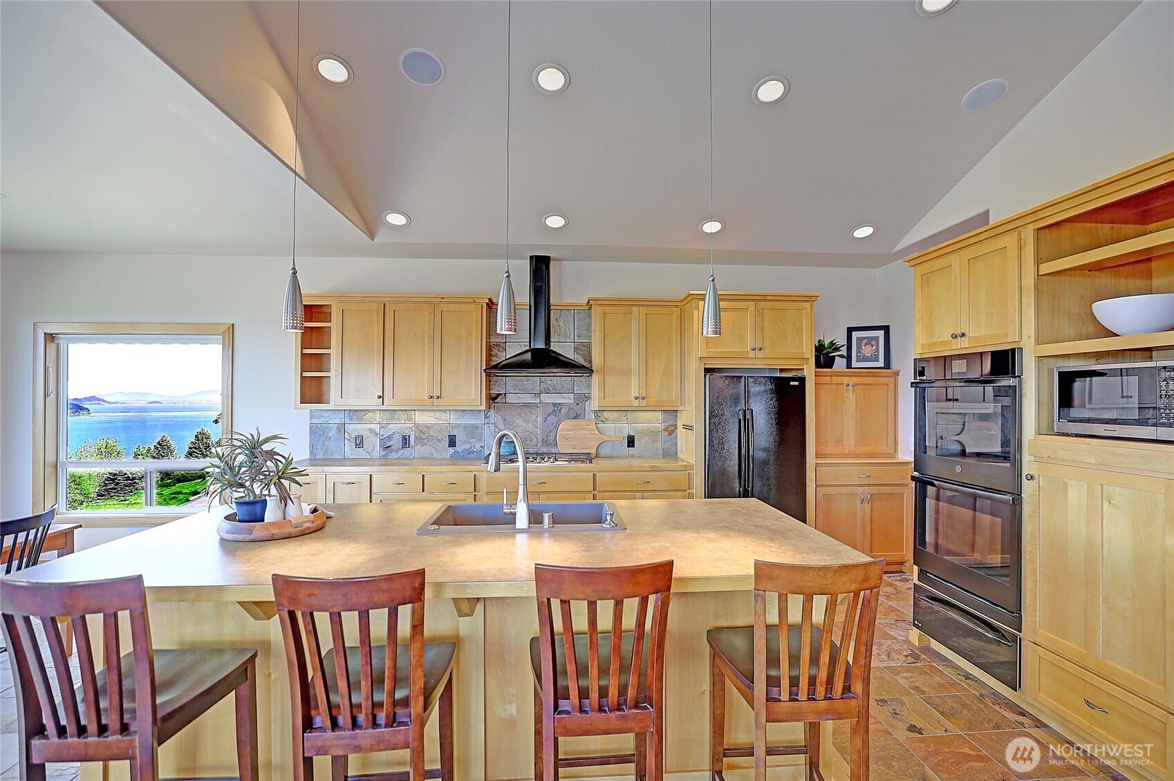 1081 Morgan Way Camano Island, WA 98282 - Photo 14 of 39 a large kitchen with a table and chairs