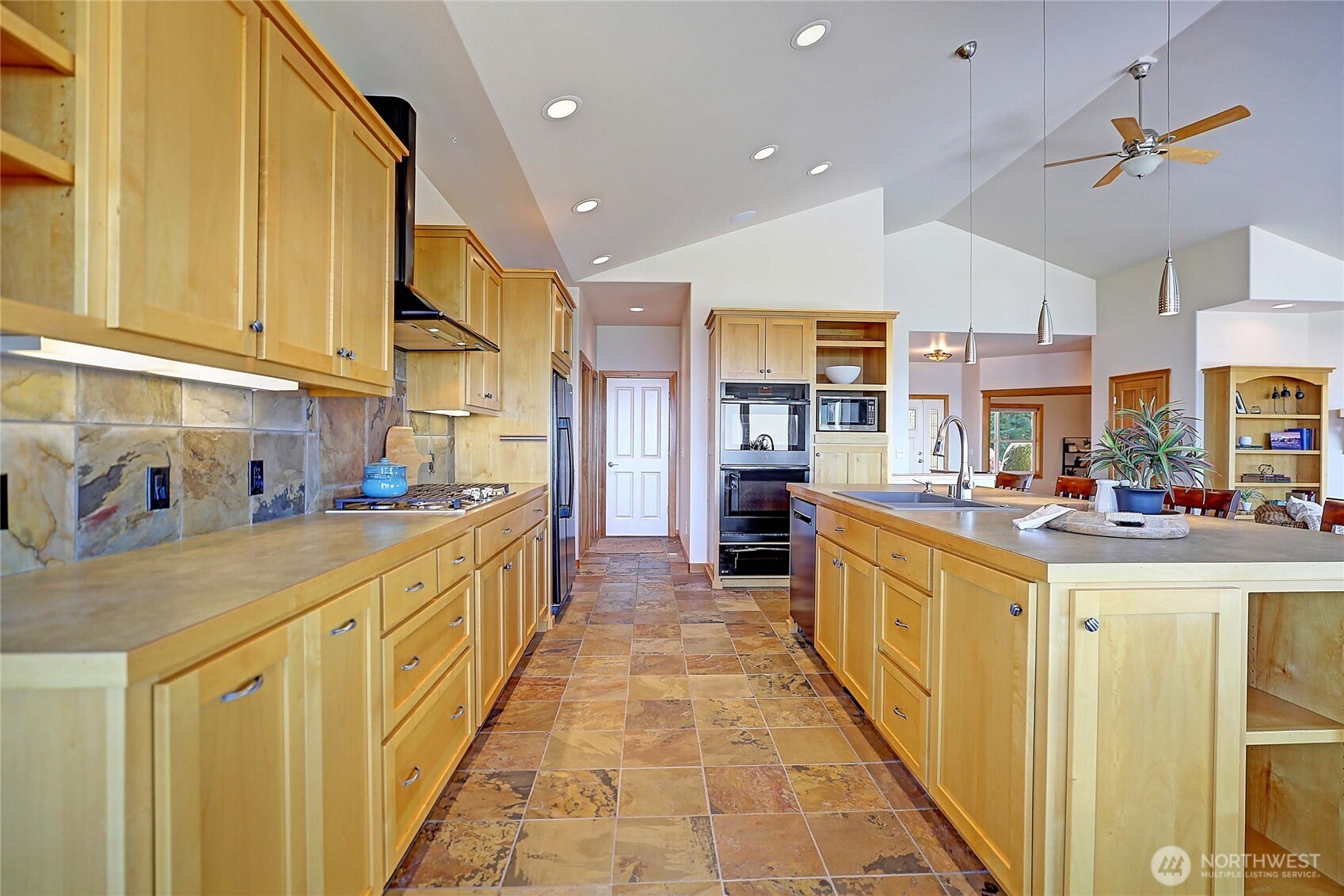 1081 Morgan Way Camano Island, WA 98282 - Photo 16 of 39 a kitchen with stainless steel appliances granite countertop a sink and cabinets