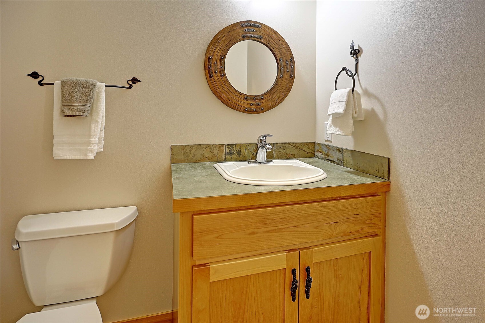 1081 Morgan Way Camano Island, WA 98282 - Photo 18 of 39 a bathroom with a toilet sink and mirror
