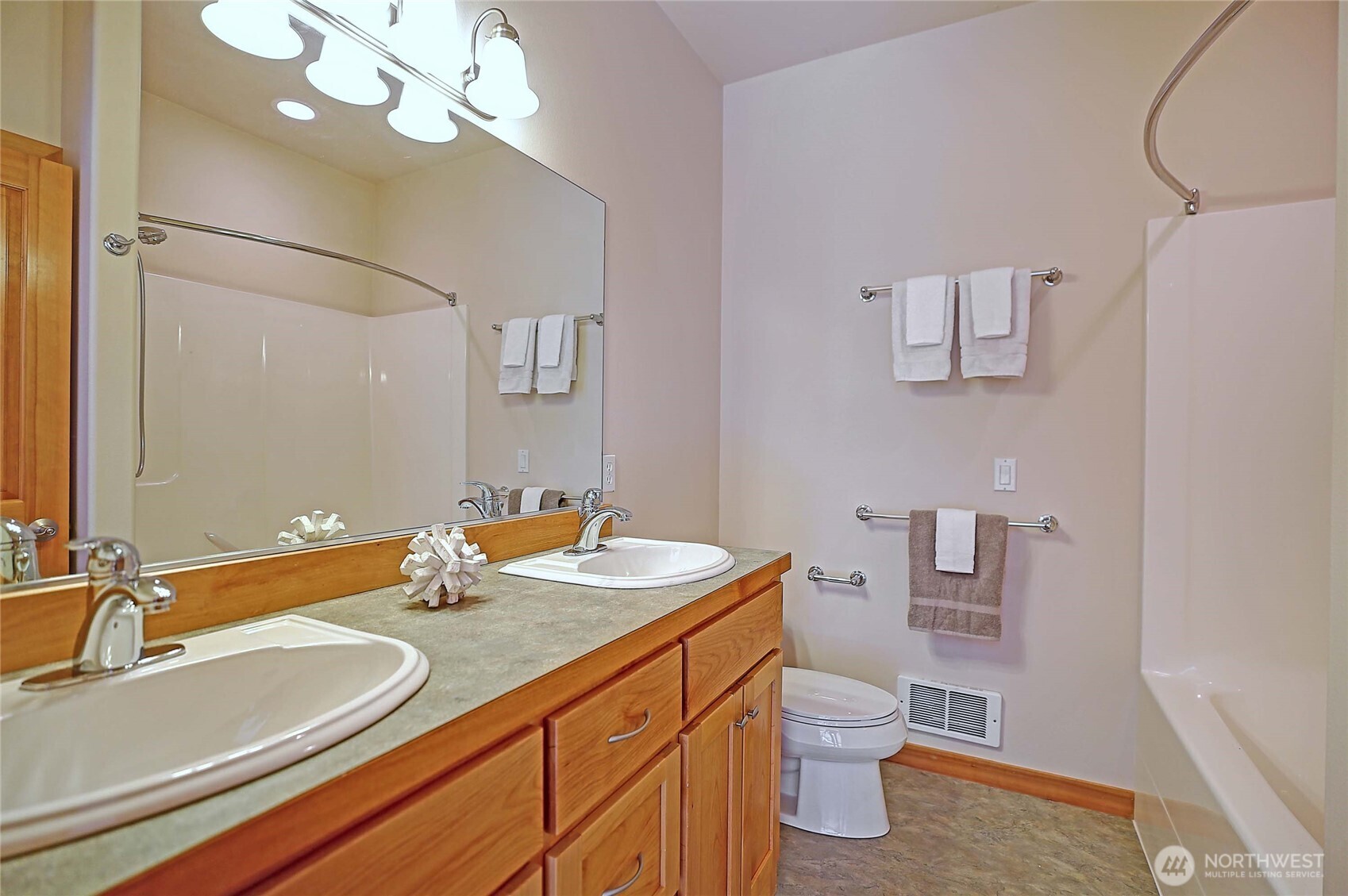 1081 Morgan Way Camano Island, WA 98282 - Photo 24 of 39 a bathroom with a double vanity sink and a mirror