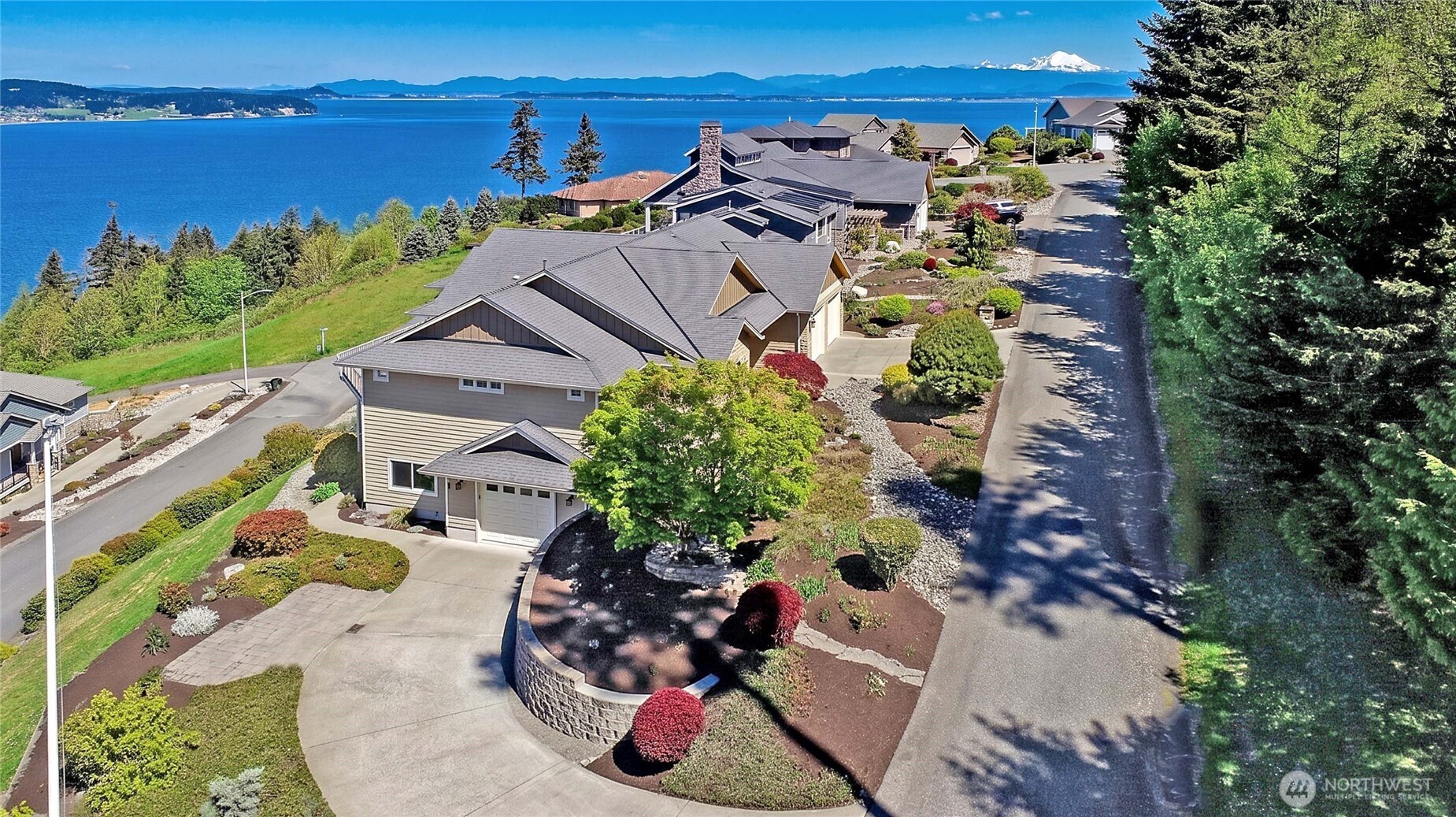 1081 Morgan Way Camano Island, WA 98282 - Photo 6 of 39 an aerial view of a house with a yard and lake view