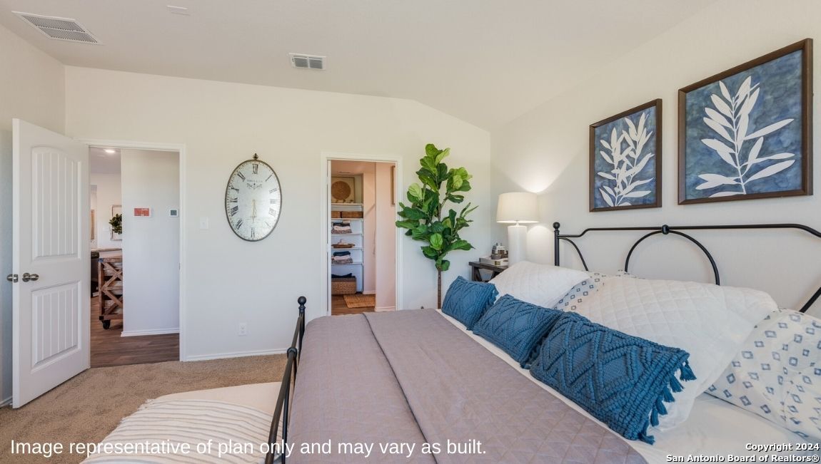 14671 Clay Rdg Run San Antonio, TX 78253 - Photo 14 of 42 a bed sitting in a bedroom next to a window