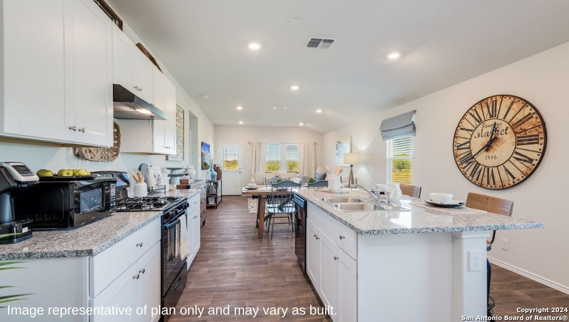 14671 Clay Rdg Run San Antonio, TX 78253 - Photo 7 of 42 a large kitchen with lots of counter space and a sink
