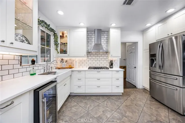 a kitchen with a sink stove and refrigerator