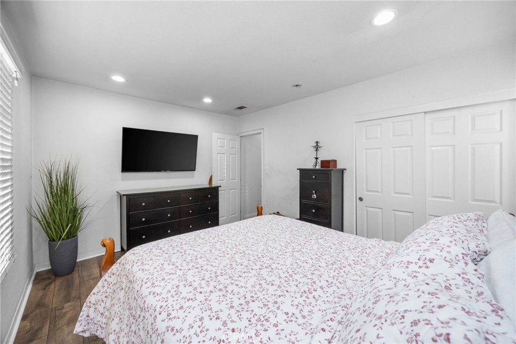 1231 South Baker Street Santa Ana, CA 92707 - Photo 19 of 48 a bedroom with a bed and a flat screen tv