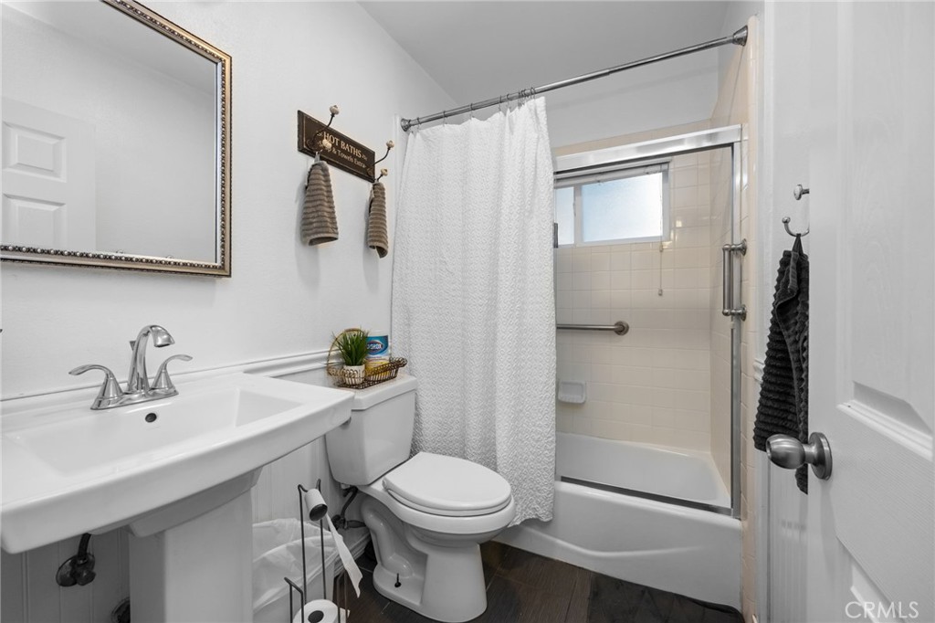 1231 South Baker Street Santa Ana, CA 92707 - Photo 23 of 48 a bathroom with a sink toilet and shower
