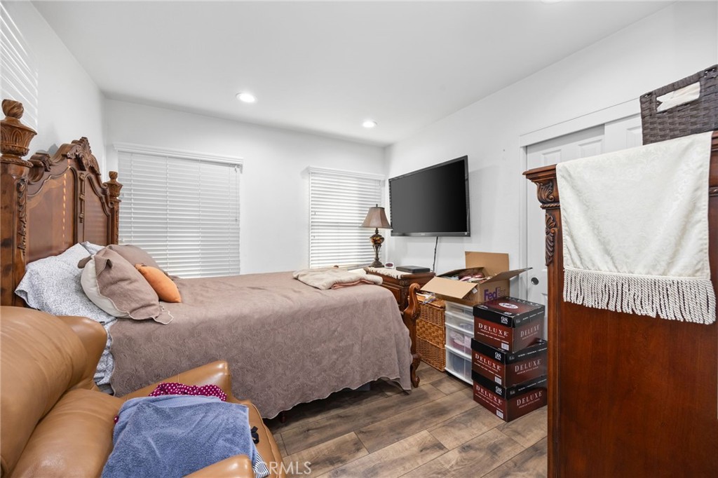 1231 South Baker Street Santa Ana, CA 92707 - Photo 25 of 48 a bedroom with a bed and flat screen tv