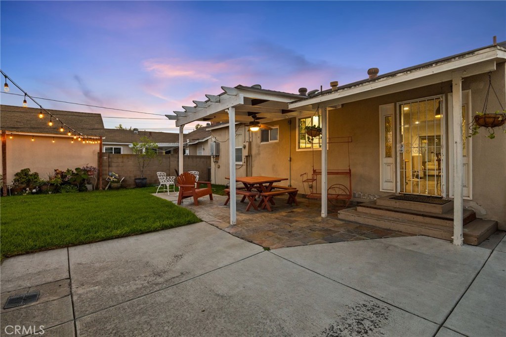 1231 South Baker Street Santa Ana, CA 92707 - Photo 30 of 48 a view of a patio with table and chairs and potted plants