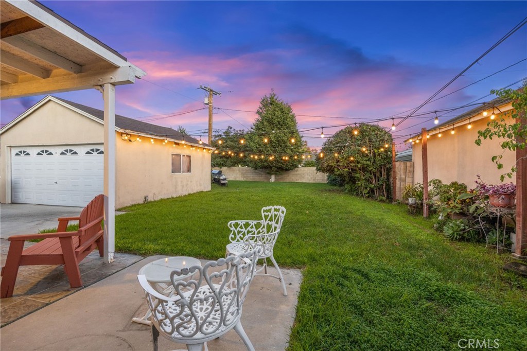 1231 South Baker Street Santa Ana, CA 92707 - Photo 35 of 48 a view of a chair and table in the garden