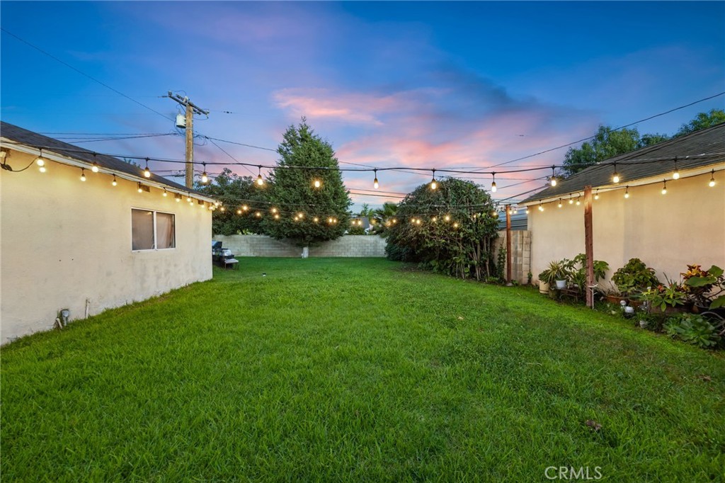 1231 South Baker Street Santa Ana, CA 92707 - Photo 36 of 48 a view of a backyard with plants and a backyard