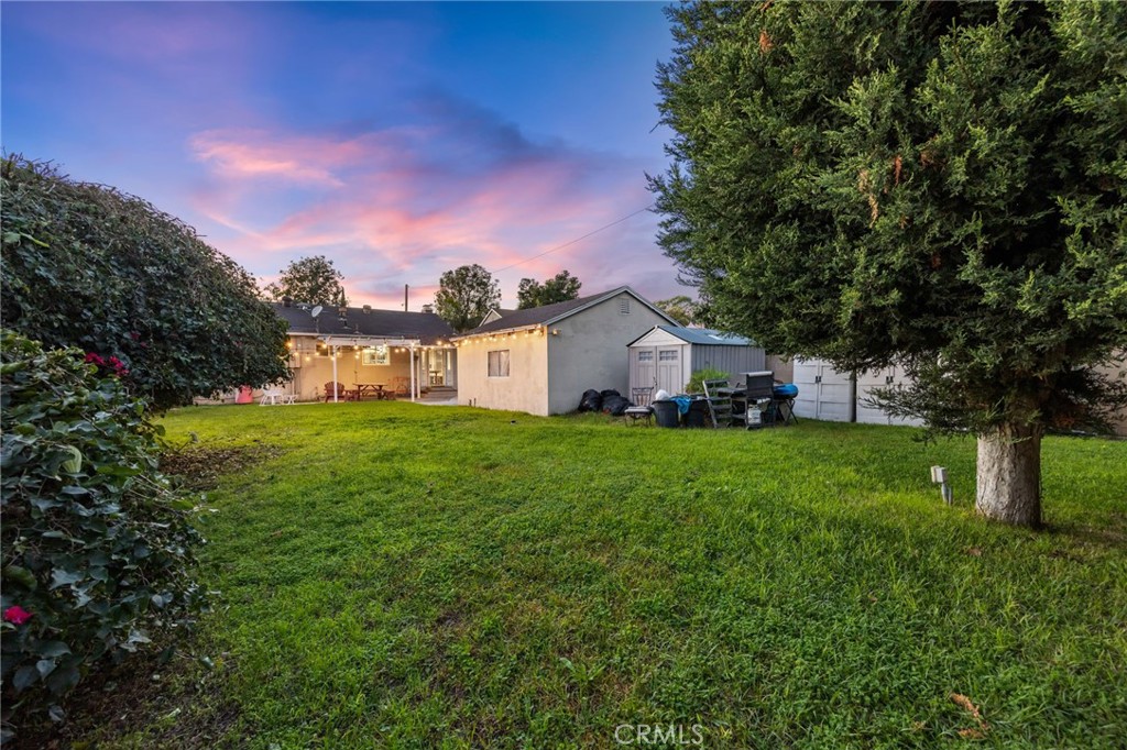 1231 South Baker Street Santa Ana, CA 92707 - Photo 37 of 48 a front view of a house with garden